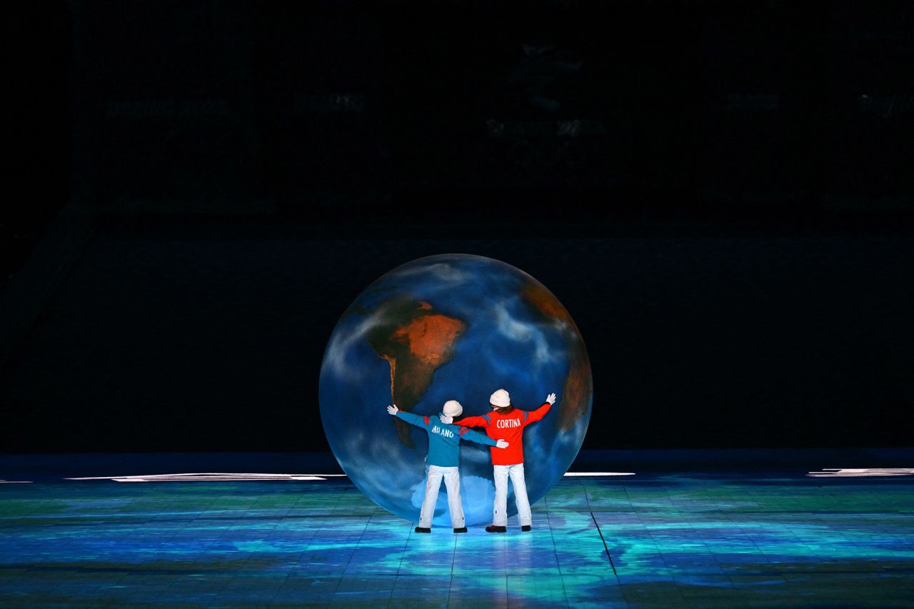 Children representing Milan and Cortina d'Ampezzo hug a globe as part of <a href="https://www.cnn.com/world/live-news/beijing-winter-olympics-02-20-22-spt/h_143bc328e23c674b7b705ce46c510cdf" target="_blank">the Olympic handover.</a>