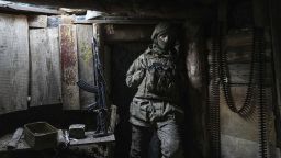 A Ukrainian serviceman stands in a shelter on a position at the line of separation between Ukraine-held territory and rebel-held territory near Zolote, Ukraine, Saturday, Feb. 19, 2022. Ukrainian President Volodymyr Zelenskyy, facing a sharp spike in violence in and around territory held by Russia-backed rebels and increasingly dire warnings that Russia plans to invade, has called for Russian President Vladimir Putin to meet him and seek a resolution to the crisis. (AP Photo/Evgeniy Maloletka)