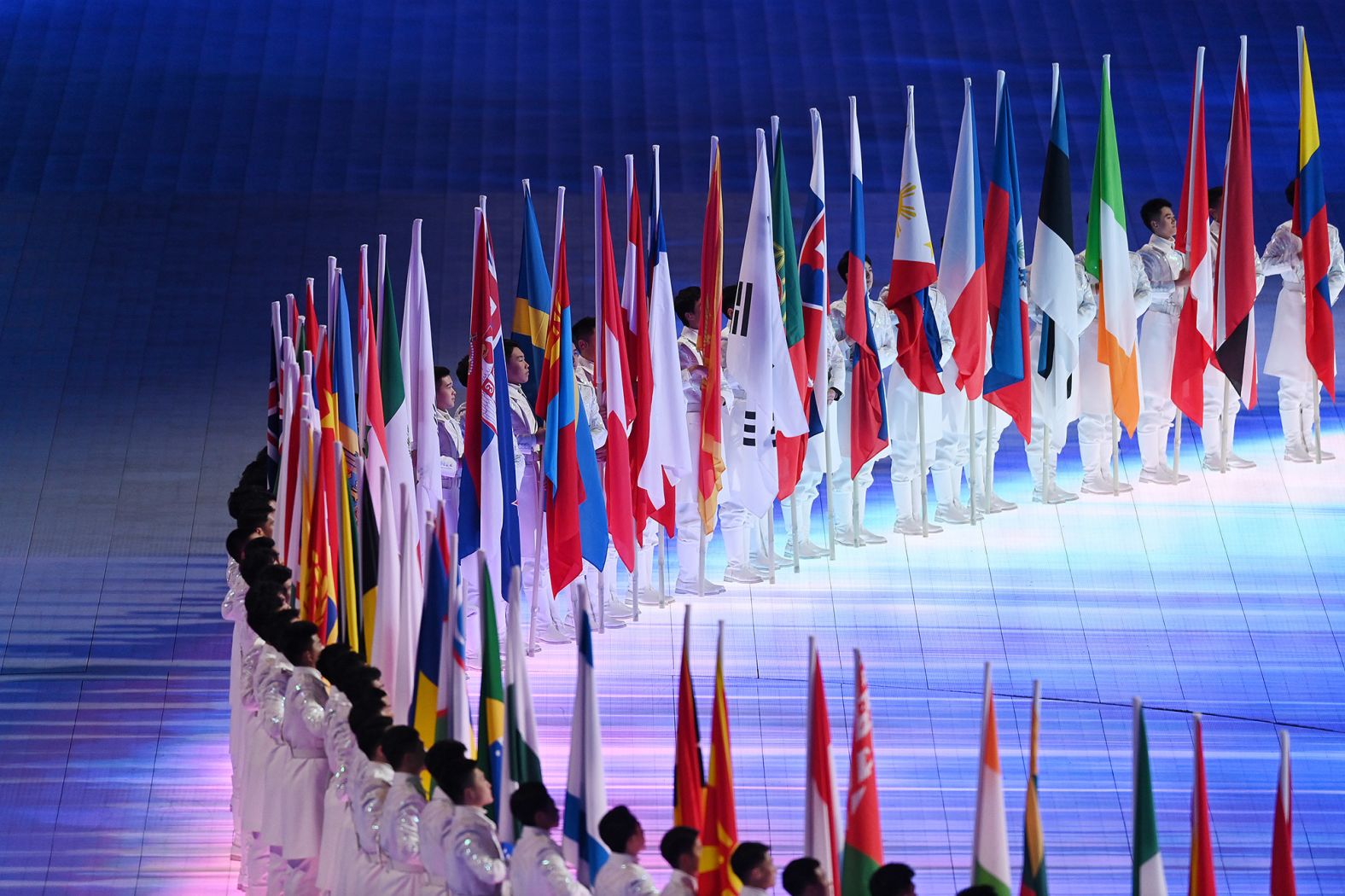 The flags of all the Olympic delegations are held inside the stadium.