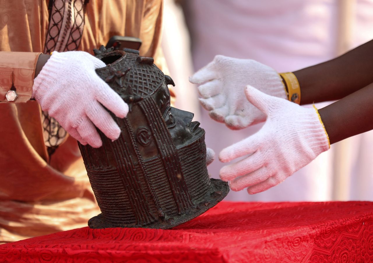 One of the repatriated artifacts that were looted from Nigeria over 125 years ago by the British military force is placed on a table inside the Oba of Benin palace.