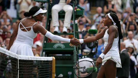 Cori "Coco" Gauff greets Venus Williams at the net after winning their women's singles match at Wimbledon 2019.