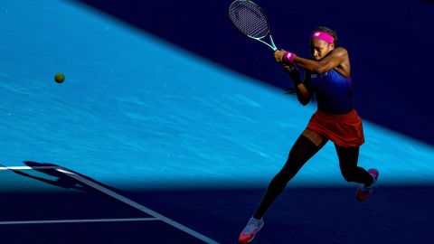 Gauff plays a backhand in her first round singles match of the Australian Open in January 2022.