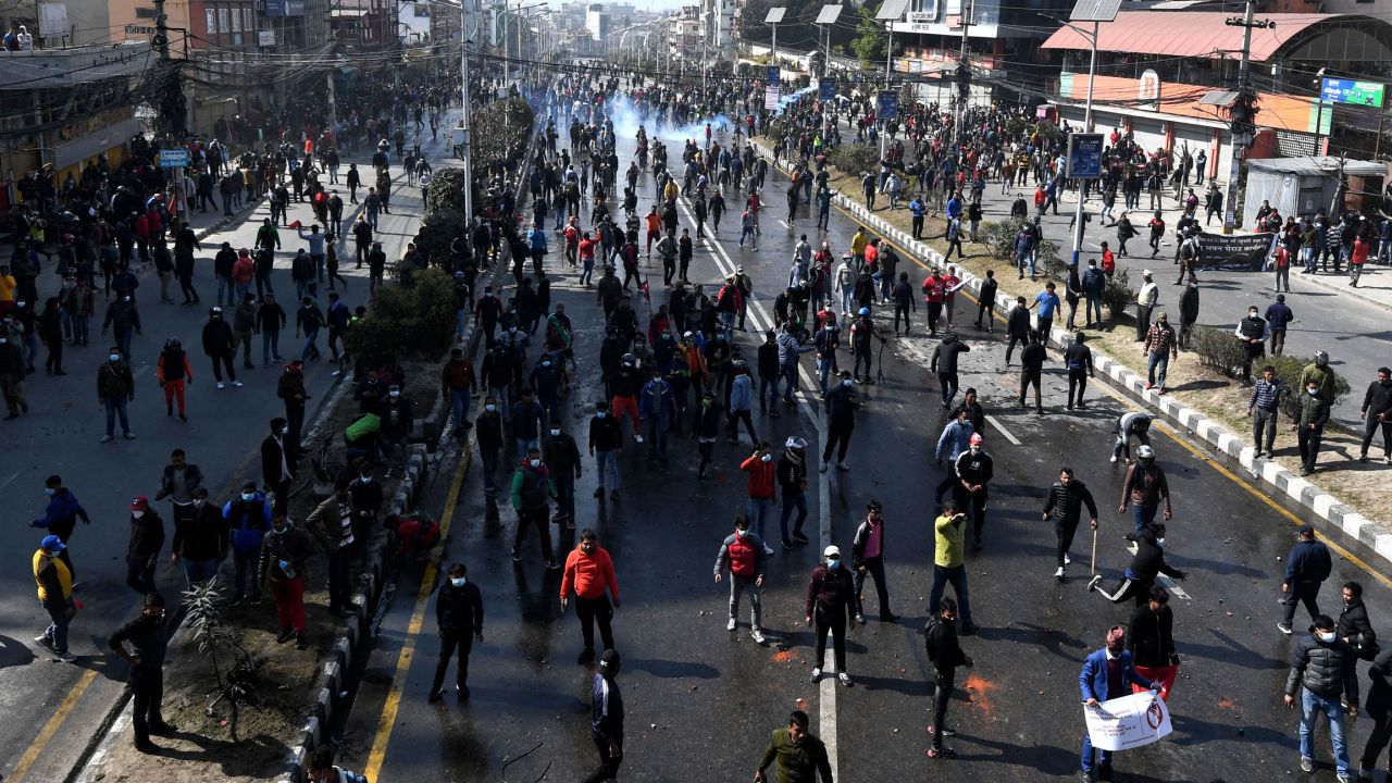 Demonstrators throw stones at police during a protest in Kathmandu, Nepal, on February 20.