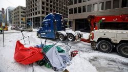 A truck is towed away in downtown Ottawa on Sunday, Feb. 20, 2022, after police worked to clear a trucker protest that was aimed at COVID-19 measures that grew into a broader anti-government protest. (Cole Burston/The Canadian Press via AP)