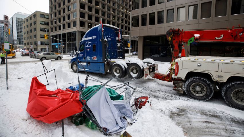 A truck is towed away in downtown Ottawa on Sunday, Feb. 20, 2022, after police worked to clear a trucker protest that was aimed at COVID-19 measures that grew into a broader anti-government protest. (Cole Burston/The Canadian Press via AP)