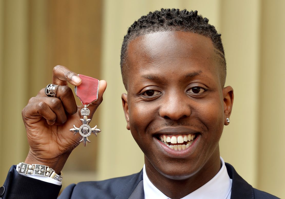 Jamal Edwards holds his Member of the British Empire (MBE), after receiving it from the Prince of Wales at Buckingham Palace on March 26, 2015.