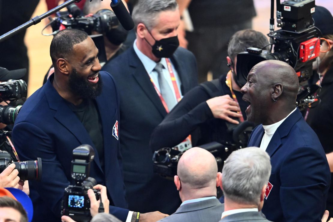 Michael Jordan and LeBron James share a moment after the 75th anniversary team selection.