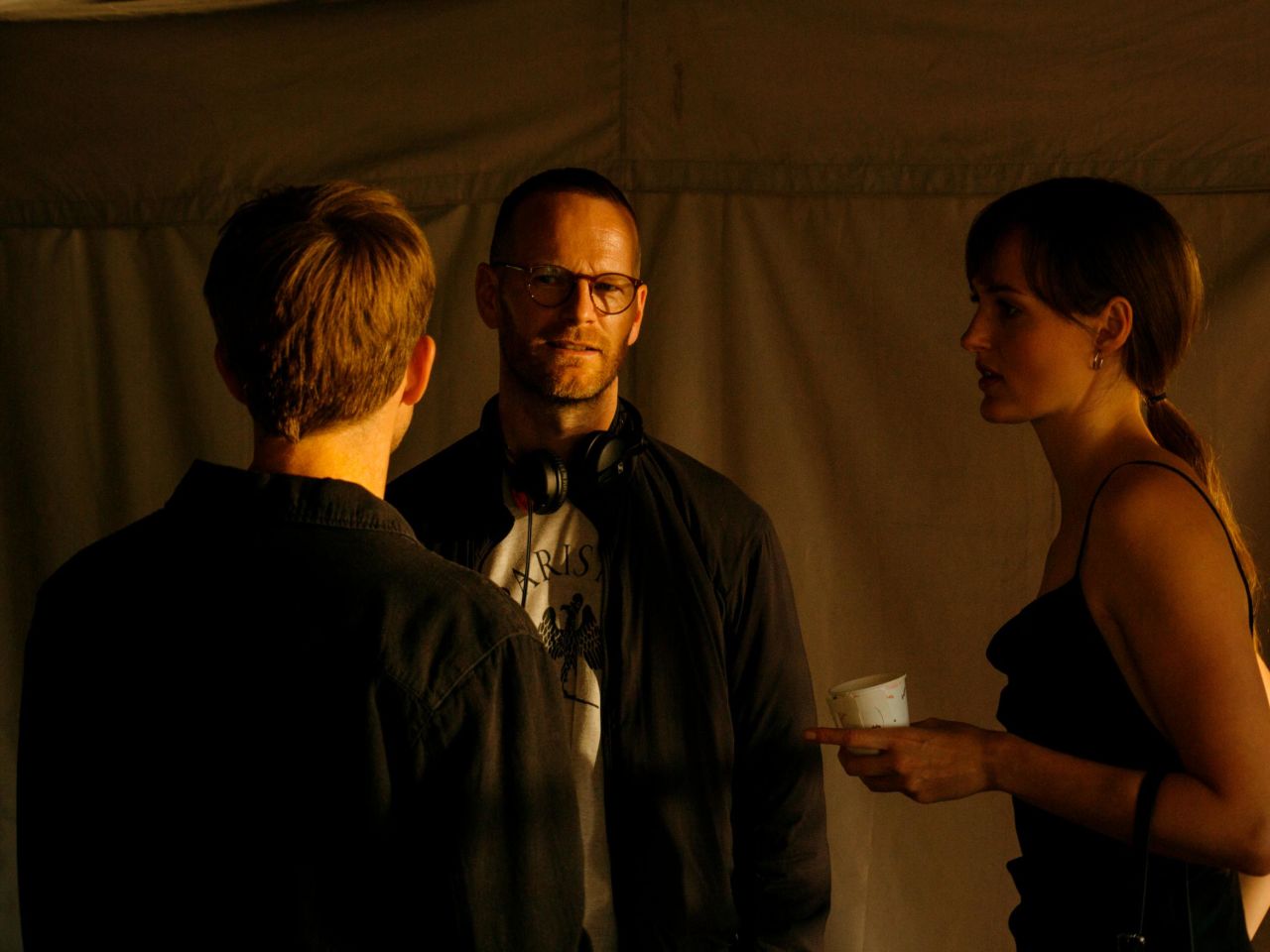 Joachim Trier alongside Anders Danielsen Lie (left) and Renate Reinsve (right) on the set of "The Worst Person in the World."