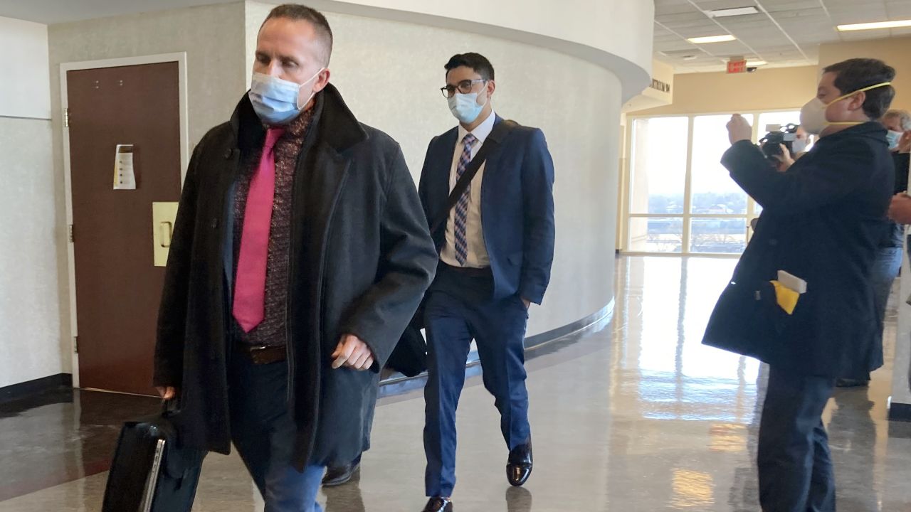 Brett Hankison, left, exits a Kentucky courtroom after the first day of jury selection in his trial earlier this month.