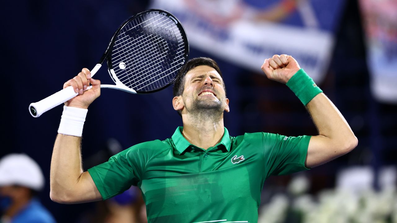 Djokovic celebrates victory against Musetti in Dubai, his first match of 2022. 