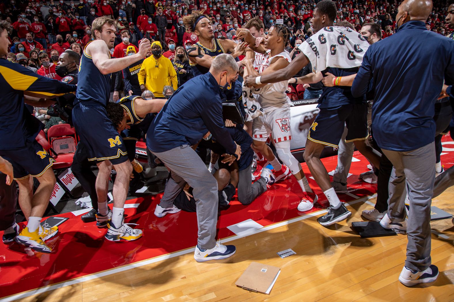 A scuffle breaks out after the Wisconsin Badgers' game against the Michigan Wolverines on Sunday, February 20. Michigan head coach Juwan Howard is <a href="index.php?page=&url=https%3A%2F%2Fwww.cnn.com%2F2022%2F02%2F21%2Fsport%2Fjuwan-howard-michigan-wisconsin-ncaa-spt-intl%2Findex.html" target="_blank">out for the rest of the regular season</a> after throwing a punch toward Wisconsin's coaching staff following the Wolverines' loss.
