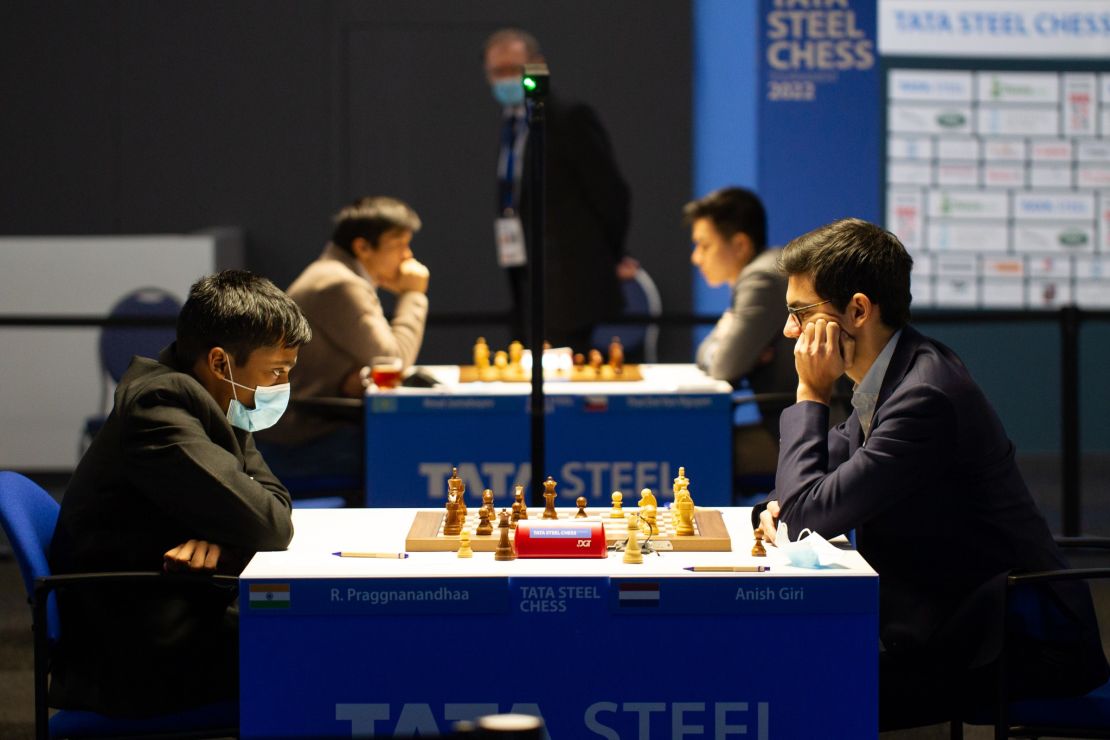 Anish Giri (R) competes against Praggnanandhaa (L) during the 2022 Tata Steel Chess Tournament.