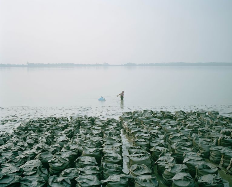 Shunta Kimura's "Living in the Transition," a finalist in the Environment category, explores the impacts of climate change in Bangladesh, which is battling river erosion, landslides and rising salinity levels.