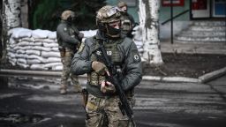 Ukrainian troops patrol in the town of Novoluhanske, eastern Ukraine, on February 19, 2022. - Ukraine's army said Saturday that two of its soldiers died in attacks in on the frontline with Russian-backed separatists, the first fatalities in the conflict in more than a month. "As a result of a shelling attack, two Ukrainian servicemen received fatal shrapnel wounds," the military command for the separatist conflict said. (Photo by ARIS MESSINIS / AFP) (Photo by ARIS MESSINIS/AFP via Getty Images)