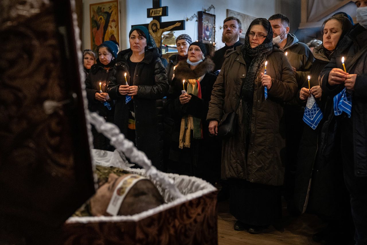Mourners gather at a church in Kyiv on February 22 for the funeral of Ukrainian Army Capt. Anton Sydorov. The Ukrainian military said he was <a target=