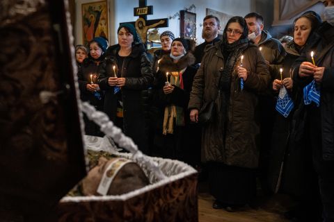 Mourners gather at a church in Kyiv on February 22 for the funeral of Ukrainian Army Capt. Anton Sydorov. The Ukrainian military said he was killed by a shrapnel wound on February 19 after several rounds of artillery fire were directed at Ukrainian positions near Myronivske.
