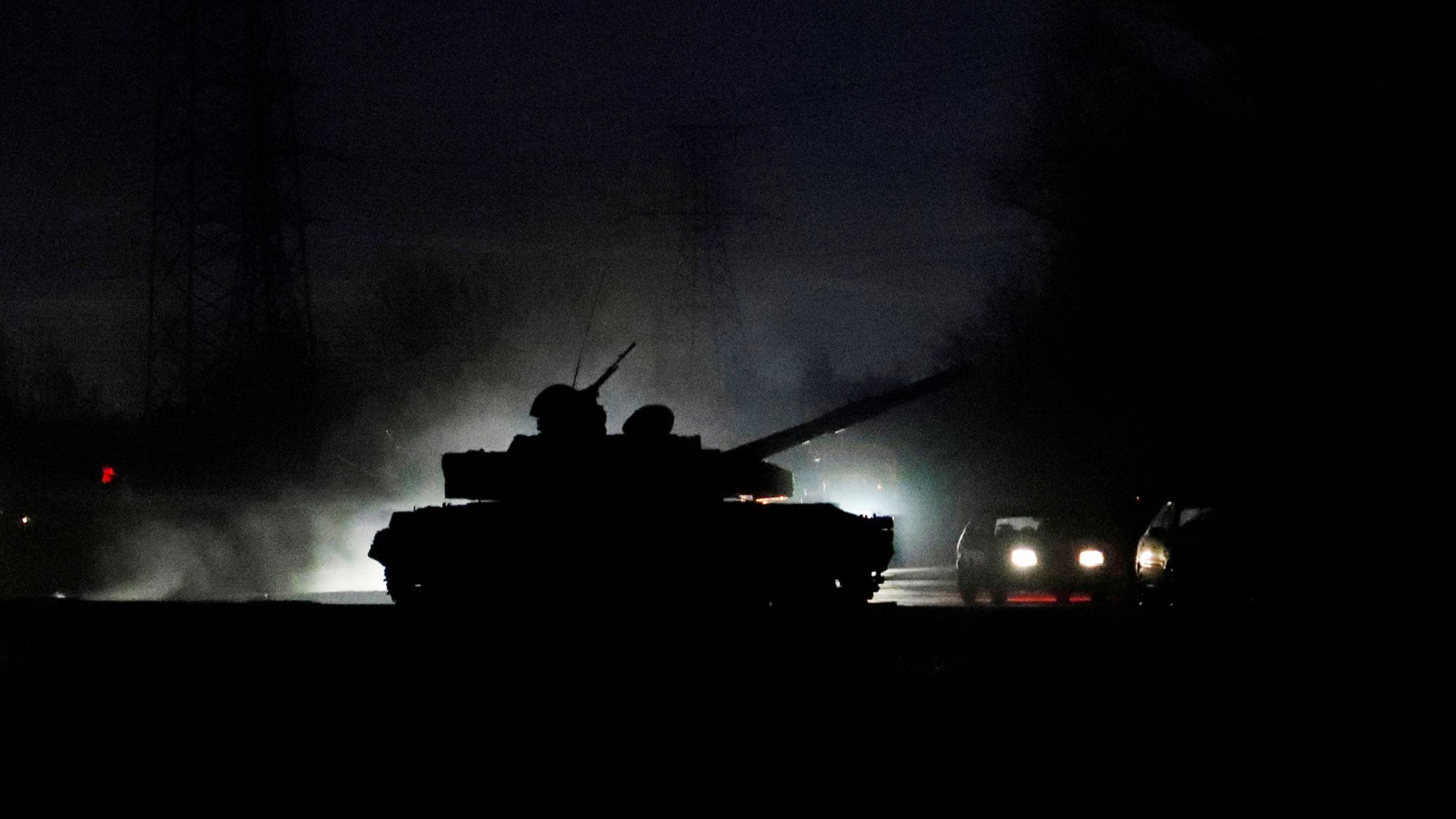 A tank drives along a street in the separatist-controlled city of Donetsk, Ukraine, on Tuesday, February 22, 2022.