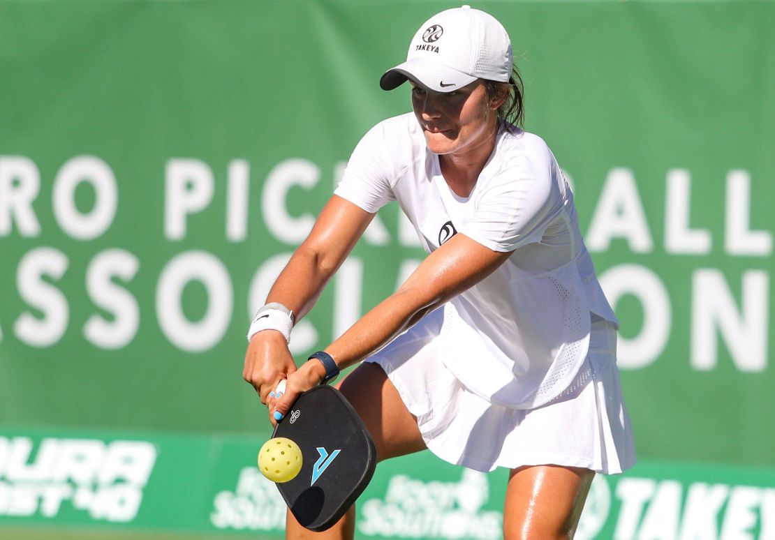 Catherine Parenteau returns the ball while playing mixed doubles during a Pro Pickleball Association masters tournament.