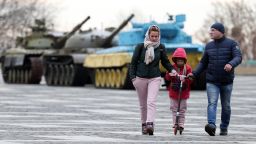 People visit the Motherland Monument in Kyiv on Monday as daily life continues in the Ukrainian capital despite growing tensions with Russia in the east of the country.