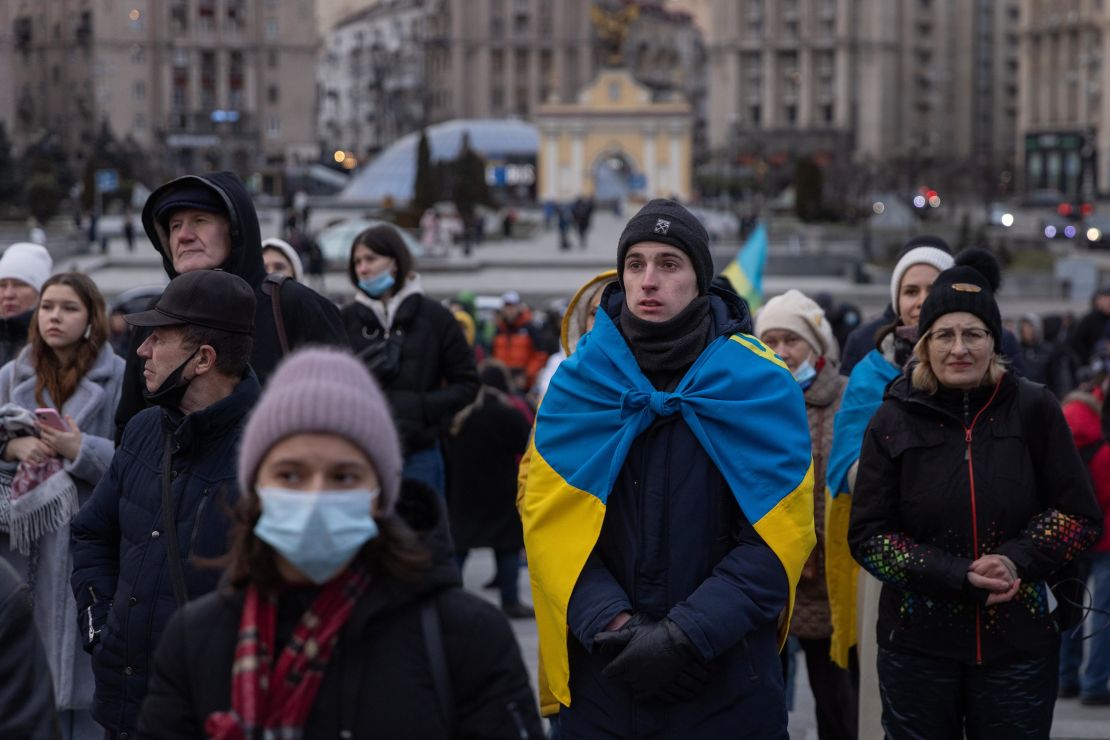 People sing the Ukrainian national anthem during a rally in support of Ukraine held during Maidan Revolution commemoration ceremonies on February 20, 2022 in Kyiv, Ukraine.