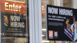 A "Now Hiring" sign outside a Home Depot store in New York, U.S., on Thursday, Feb. 17, 2022. 