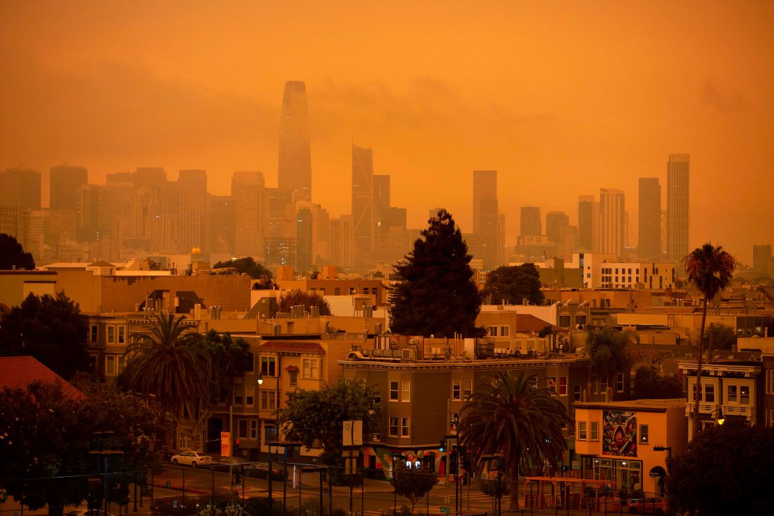 A hazy San Francisco skyline is seen from Dolores Park in September 2020 as more than 300,000 acres burned across the state.