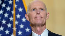 FILE - Sen. Rick Scott, R-Fla., talks with reporters on Capitol Hill in Washington, on Jan. 20, 2022. He was talking about President Joe Biden's first year as president. Two widely supported bills are encountering delays in the Senate. The House easily approved the measures last week with broad bipartisan support. (AP Photo/Susan Walsh, File)