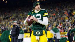 Green Bay Packers quarterback Aaron Rodgers (12) throws a pass on the sideline prior to an NFL divisional playoff football game against the San Francisco 49ers, Saturday, Jan. 22, 2022, in Green Bay, Wis. The 49ers defeated the Packers, 13-10. (Ryan Kang via AP)