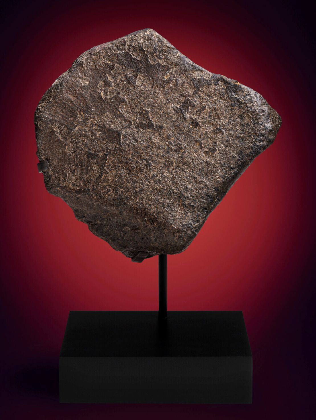 A Mars rock thought to be the third largest piece of Mars on Earth is shown at Christie's online-only auction: 'Deep Impact: Martian Lunar and Other Rare Meteorites', in February 2022. 