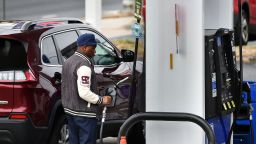 A man fills up at a gas station in Bethesda, Maryland on February 23, 2022. 