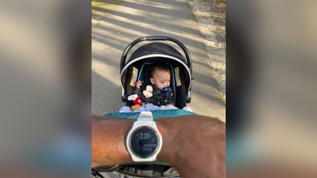 Brandon McCormick showing his completed 2.23 mile run with his youngest son, Landon McCormick. 