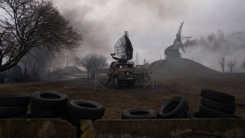 Smoke rises from an air defense base in the aftermath of an apparent Russian strike in Mariupol on February 24, 2022.