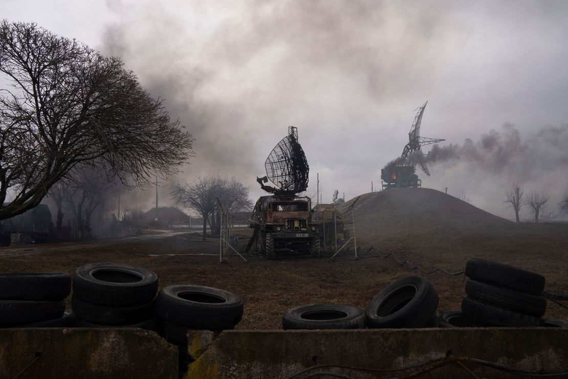Smoke rises from an air defense base in the aftermath of an apparent Russian strike in Mariupol on February 24, 2022.
