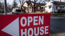 An "Open House" sign is displayed in the front yard of a home for sale in Columbus, Ohio, U.S., on Sunday, Dec. 3, 2017.