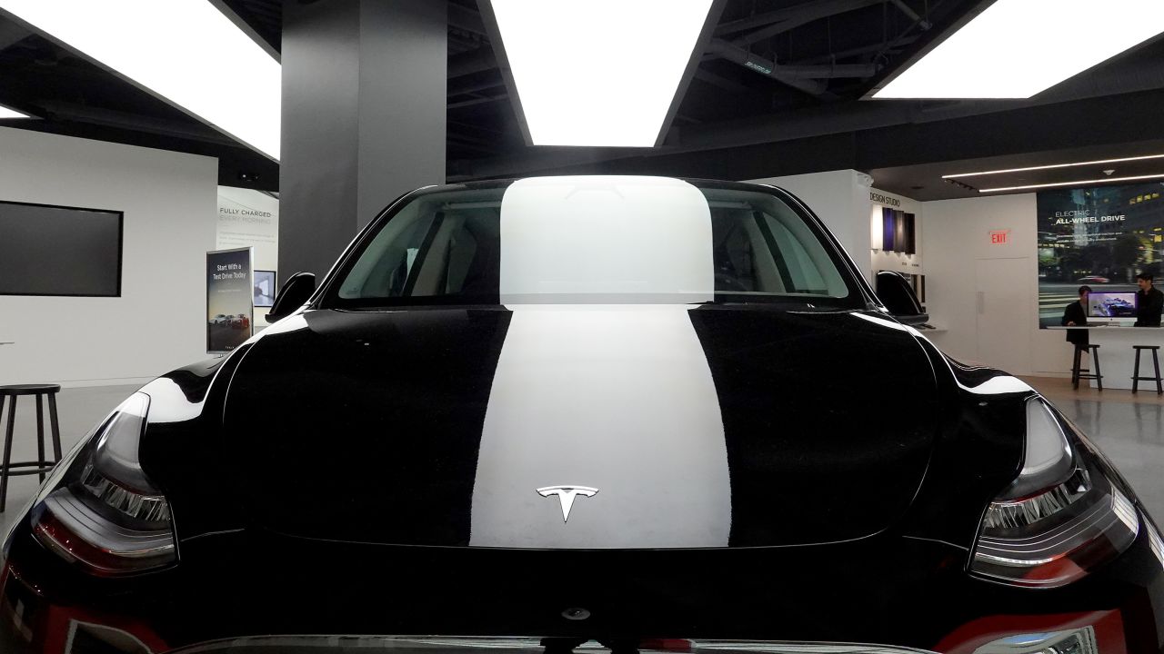 A Tesla Model Y electric vehicle is dispalyed on a showroom floor at the Miami Design District on October 21, 2021 in Miami, Florida. 