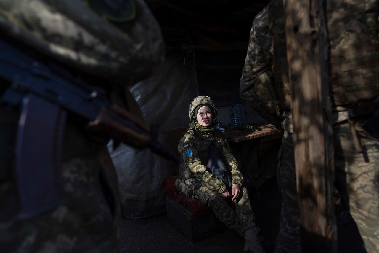 Ukrainian soldiers talk in a shelter at the front line near Svitlodarsk, Ukraine, on February 23.