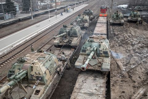 Russian howitzers are loaded onto train cars near Taganrog, Russia, on February 22.