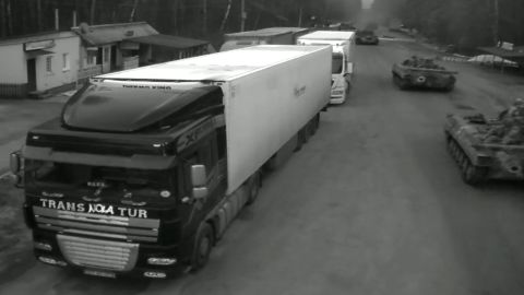 Military vehicles are seen on a livestream video entering Ukraine from Belarus.