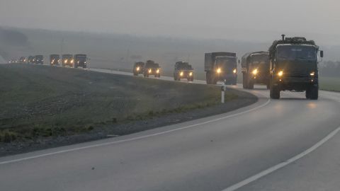 A convoy of Russian military vehicles is seen moving towards the border in the Donbas region of eastern Ukraine on February 23, a day before the Russian assault began. 