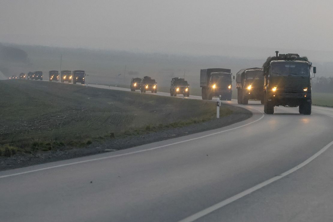 A convoy of Russian military vehicles is seen moving towards the border in the Donbas region of eastern Ukraine on February 23, a day before the Russian assault began. 