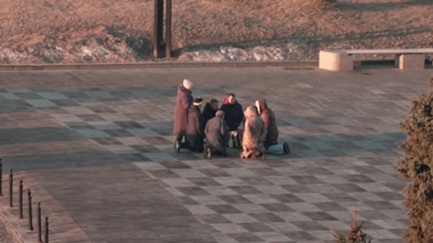 people praying Kharkiv Ukraine
