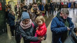 Tanya, with her children Sasha and Masha, wait on line to buy train tickets at the central train station in Kyiv, Ukraine, Thursday, February 24th, 2022.Photograph: Timothy Fadek / Redux