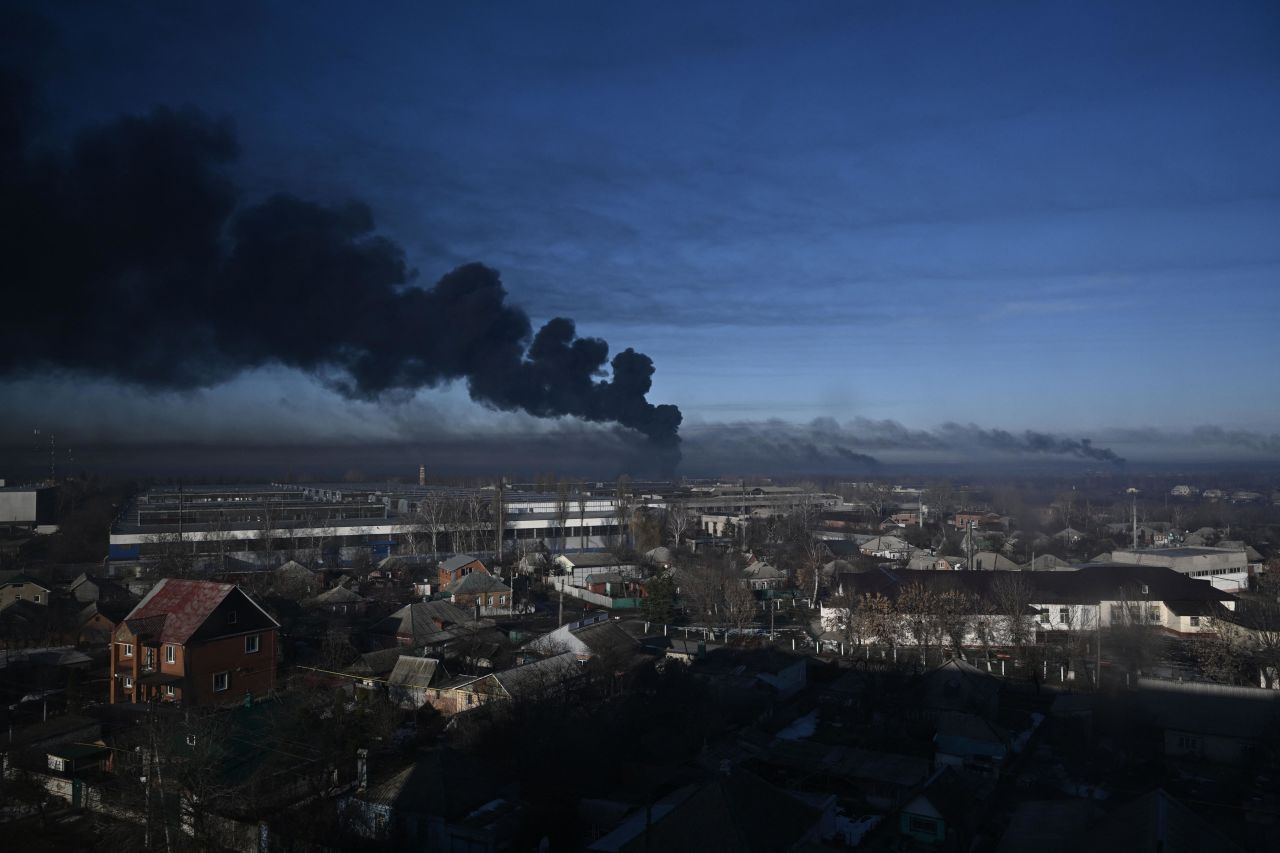 Smoke rises from a military airport in Chuhuiv on February 24. <a href=  Zelensky says Russia waging war so Putin can stay in power &#8216;until the end of his life&#8217; w 1280