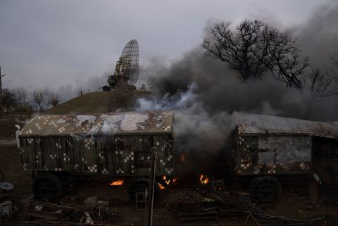 Smoke rises from an air defense base after an apparent Russian strike in Mariupol on February 24. A CNN team in Mariupol reported hearing a barrage of artillery.