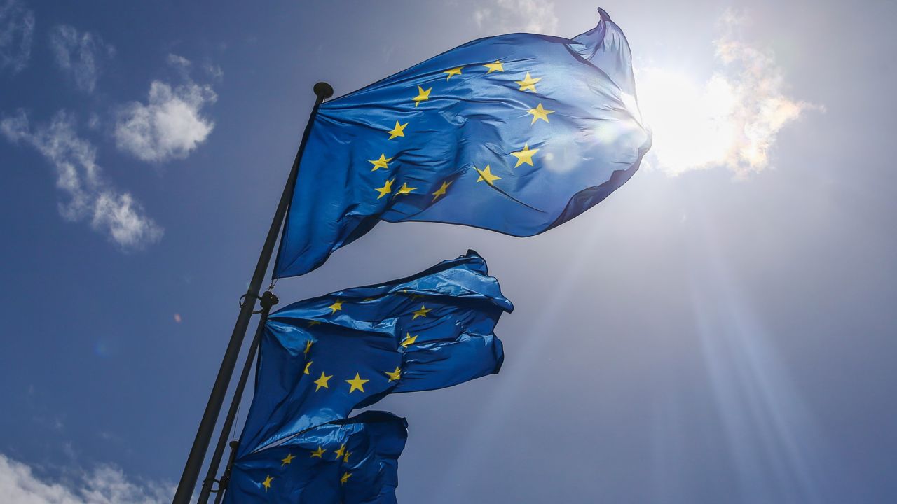 European Union flags fly outside their headquarters in Brussels, in 2021. 