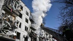 Firefighters work on a fire on a building after bombings on the eastern Ukraine town of Chuguiv on February 24, 2022, as Russian armed forces are trying to invade Ukraine from several directions, using rocket systems and helicopters to attack Ukrainian position in the south, the border guard service said. - Russia's ground forces on Thursday crossed into Ukraine from several directions, Ukraine's border guard service said, hours after President Vladimir Putin announced the launch of a major offensive. Russian tanks and other heavy equipment crossed the frontier in several northern regions, as well as from the Kremlin-annexed peninsula of Crimea in the south, the agency said. (Photo by Aris Messinis / AFP) (Photo by ARIS MESSINIS/AFP via Getty Images)