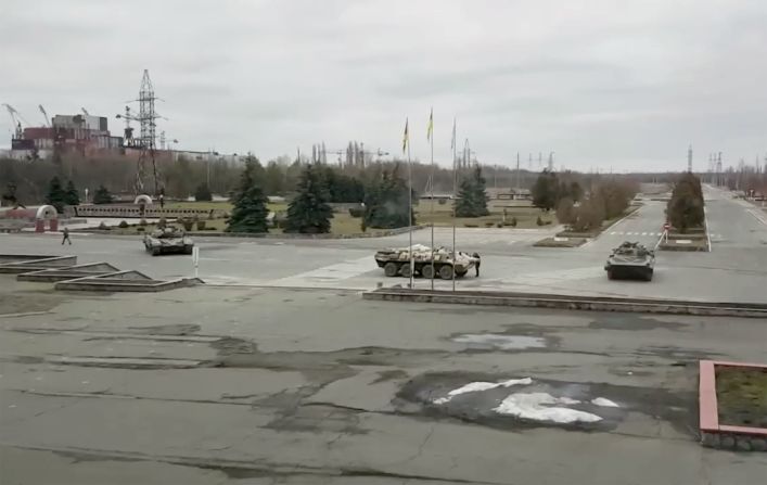 Russian military vehicles are seen at the Chernobyl power plant near Pripyat, Ukraine, on February 24. Russian forces <a href="index.php?page=&url=https%3A%2F%2Fwww.cnn.com%2F2022%2F02%2F24%2Feurope%2Fukraine-chernobyl-russia-intl%2Findex.html" target="_blank">seized control of the the plant,</a> the site of the world's worst nuclear disaster.