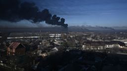 TOPSHOT - Black smoke rises from a military airport in Chuguyev near Kharkiv  on February 24, 2022. - Russian President Vladimir Putin announced a military operation in Ukraine today with explosions heard soon after across the country and its foreign minister warning a "full-scale invasion" was underway. (Photo by Aris Messinis / AFP) (Photo by ARIS MESSINIS/AFP via Getty Images)