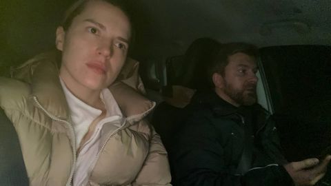 Yana and Sergii Lysenko ride in their car.