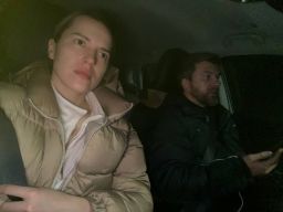 Yana and Sergii Lysenko ride in their car.